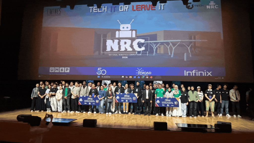 Students programming bipedal robots at the National Robotics Competition at UM6P Benguerir campus  